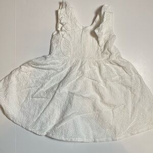 White sleeveless eyelet dress